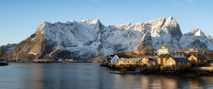 Preview wallpaper houses, pier, mountains, snow, sea