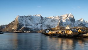 Preview wallpaper houses, pier, mountains, snow, sea