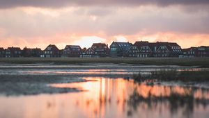 Preview wallpaper houses, river, clouds, sunset, juist, germany