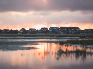 Preview wallpaper houses, river, clouds, sunset, juist, germany