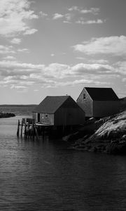 Preview wallpaper houses, river, pier, piles, bw