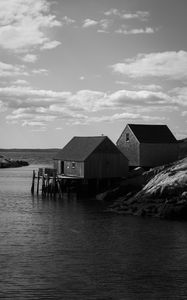 Preview wallpaper houses, river, pier, piles, bw