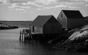 Preview wallpaper houses, river, pier, piles, bw