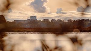 Preview wallpaper houses, river, shore, grass, blur