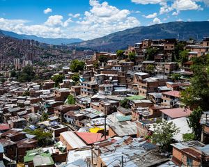 Preview wallpaper houses, roofs, buildings, city, mountains