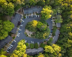 Preview wallpaper houses, roofs, road, trees, aerial view, usa