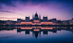 Preview wallpaper hungary, building, sunset, facade, lights