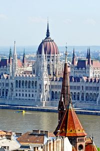 Preview wallpaper hungary, city, houses, sky, clouds