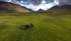 Preview wallpaper hut, building, field, grass, rocks