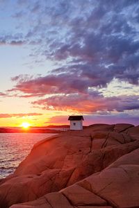 Preview wallpaper hut, coast, rocks, sunset, sea