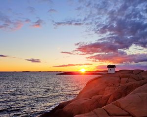 Preview wallpaper hut, coast, rocks, sunset, sea