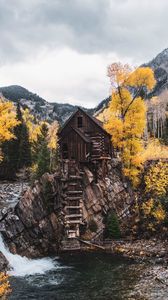 Preview wallpaper hut, rock, trees, river, autumn, landscape