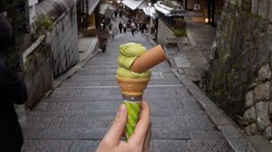 Preview wallpaper ice cream, dessert, hand, street, buildings, japan