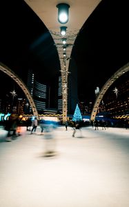 Preview wallpaper ice rink, people, blur, long exposure