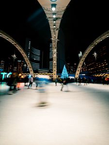 Preview wallpaper ice rink, people, blur, long exposure