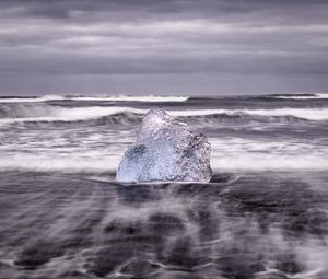 Preview wallpaper ice, rock, sea, waves, clouds