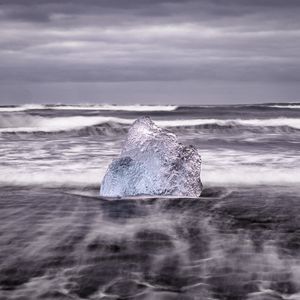 Preview wallpaper ice, rock, sea, waves, clouds