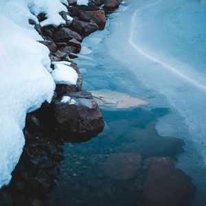 Preview wallpaper ice, snow, stones, shore, frozen