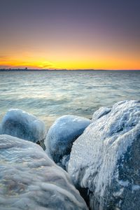 Preview wallpaper ice, stones, frozen, coast, winter