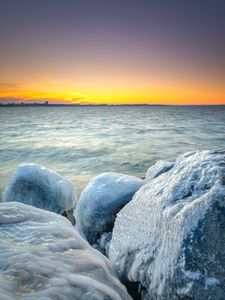 Preview wallpaper ice, stones, frozen, coast, winter