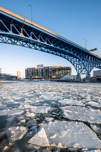 Preview wallpaper ice, water, cranny, bridge, building, winter