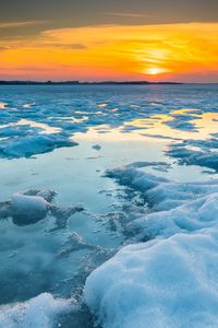 Preview wallpaper ice, water, sunset, winter, horizon, nature