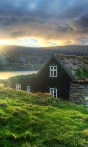 Preview wallpaper iceland, house, stones, decline, lake, mountains, eremite