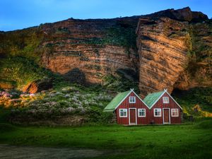 Preview wallpaper iceland, mountain, rock, lodges, light, meadow