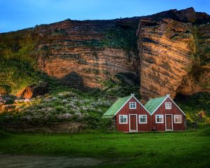 Preview wallpaper iceland, mountain, rock, lodges, light, meadow