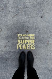 Preview wallpaper inscription, superpower, text, asphalt, feet