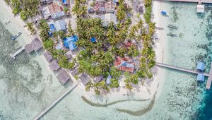 Preview wallpaper island, aerial view, sea, city, buildings, coast