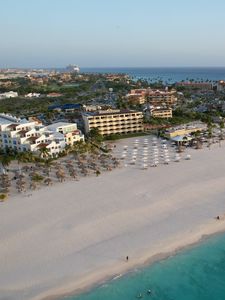 Preview wallpaper island, beach, buildings, sea