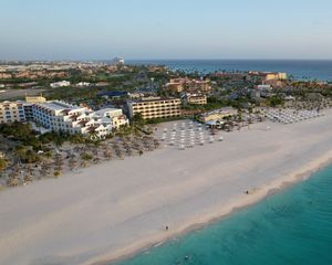 Preview wallpaper island, beach, buildings, sea