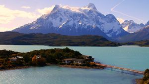 Preview wallpaper island, bridge, mountains, home, sky, trace