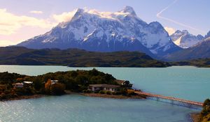 Preview wallpaper island, bridge, mountains, home, sky, trace