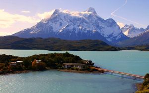 Preview wallpaper island, bridge, mountains, home, sky, trace