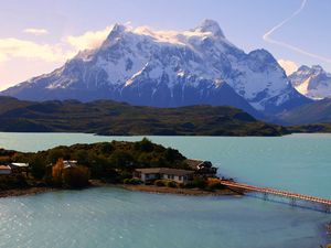 Preview wallpaper island, bridge, mountains, home, sky, trace