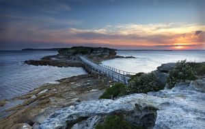 Preview wallpaper island, bridge, sea, stones, dusk