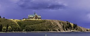 Preview wallpaper island, building, hill, sea, landscape