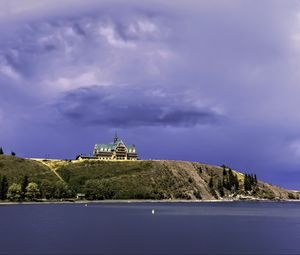 Preview wallpaper island, building, hill, sea, landscape