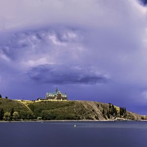 Preview wallpaper island, building, hill, sea, landscape