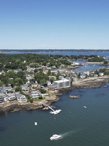 Preview wallpaper island, buildings, coast, pier, boats, sea