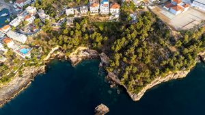 Preview wallpaper island, buildings, sea, aerial view
