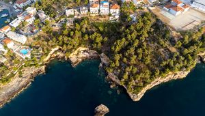 Preview wallpaper island, buildings, sea, aerial view