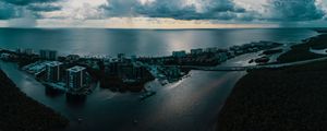 Preview wallpaper island, city, aerial view, clouds, sea, ocean, twilight