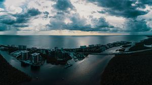Preview wallpaper island, city, aerial view, clouds, sea, ocean, twilight