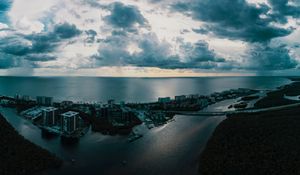 Preview wallpaper island, city, aerial view, clouds, sea, ocean, twilight