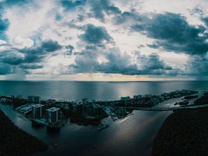 Preview wallpaper island, city, aerial view, clouds, sea, ocean, twilight