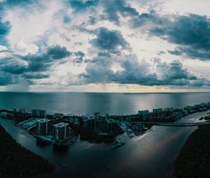 Preview wallpaper island, city, aerial view, clouds, sea, ocean, twilight