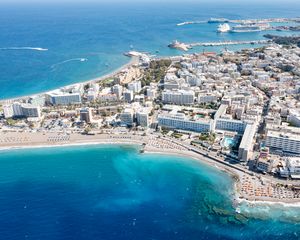 Preview wallpaper island, city, buildings, sea, aerial view